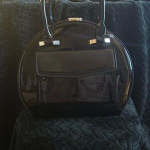 La Terre black patent goldtone trim bag with strap